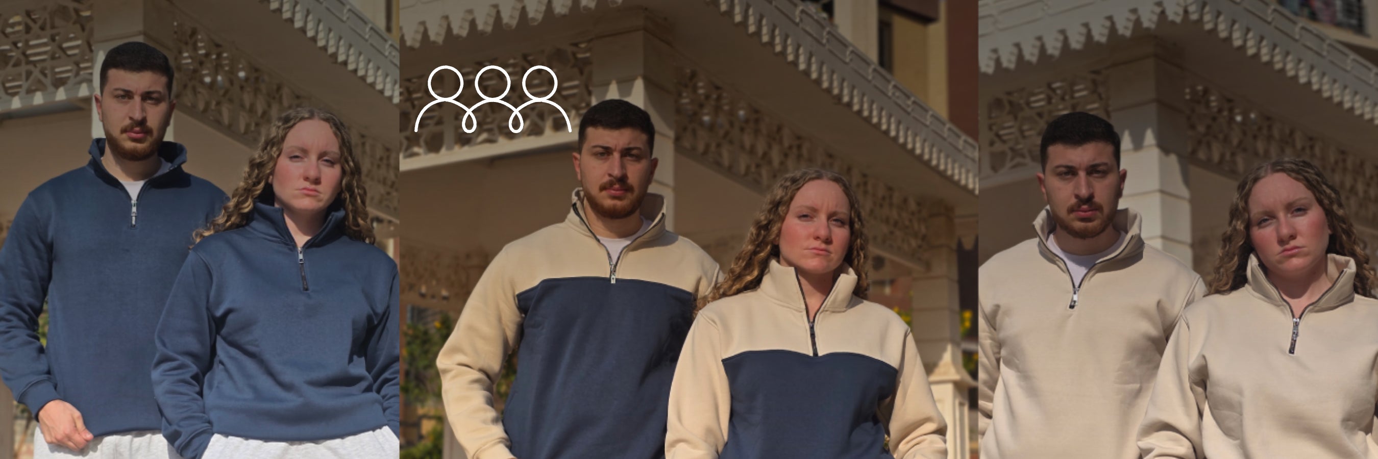 Two people wearing matching blue and beige jackets standing in front of a decorative building.